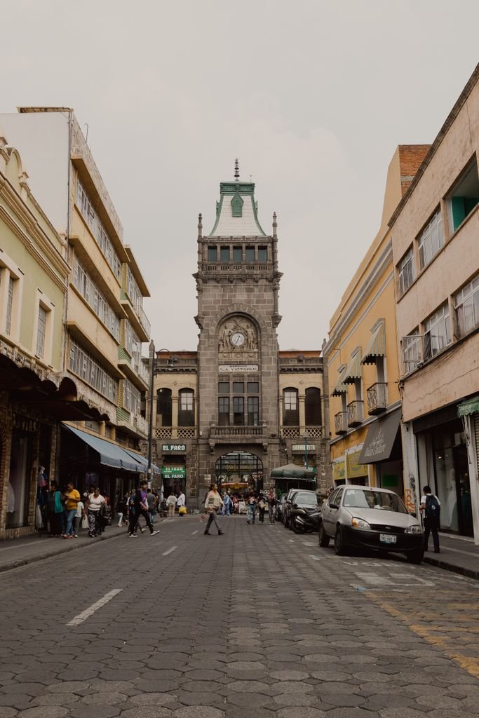 Street scene in Heroica Puebla de Zaragoza featuring historic architecture and urban life.