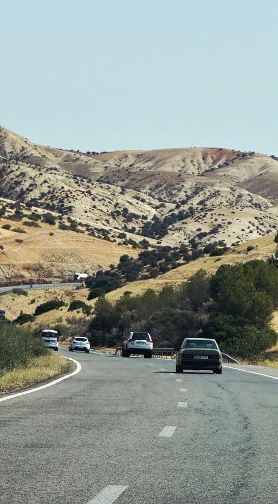 A picturesque road trip through the hilly landscapes near Azrou, Fès-Meknès, capturing natural beauty.