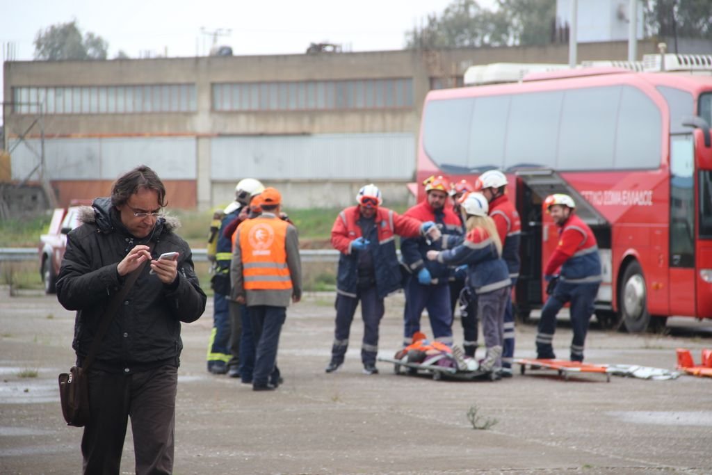Emergency responders assist at a roadside accident scene in Eleusis, Greece.